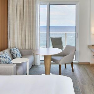 Guest room king bed sofa bed coast view or ocean view wraparound balcony